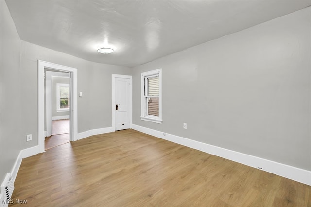 523 Gage St, Akron, OH 44311 - spare room with baseboards and light wood-style flooring