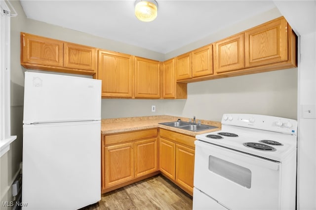 523 Gage St, Akron, OH 44311 - kitchen with white appliances, light wood-style floors, and light countertops