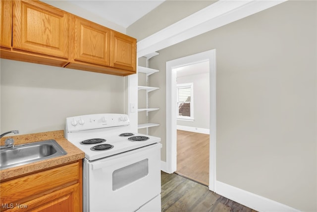 523 Gage St, Akron, OH 44311 - kitchen featuring white range with electric stovetop, light countertops, wood finished floors, and open shelves