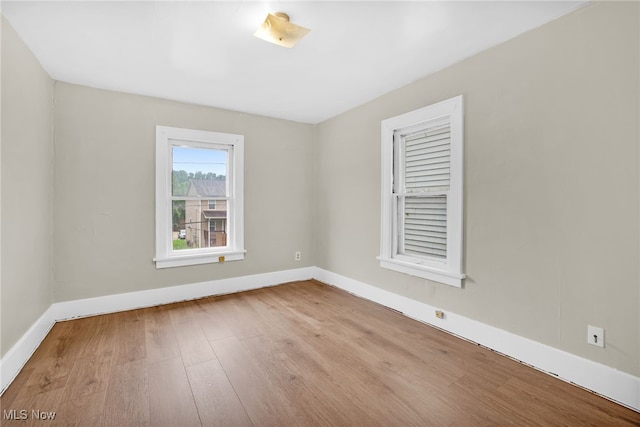523 Gage St, Akron, OH 44311 - empty room featuring wood finished floors and baseboards