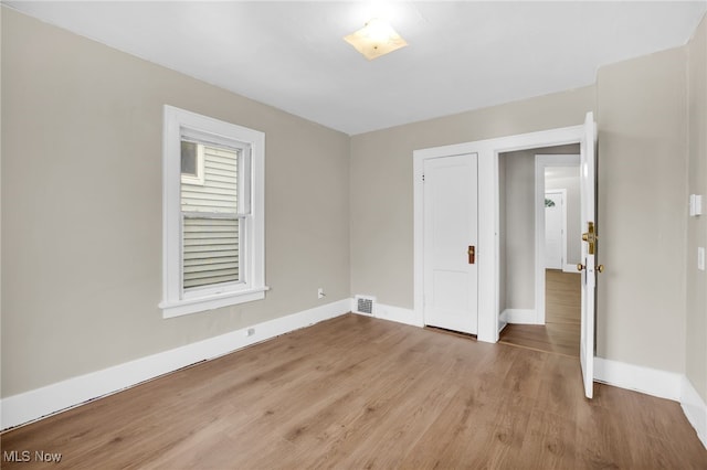 523 Gage St, Akron, OH 44311 - unfurnished bedroom with baseboards and wood finished floors