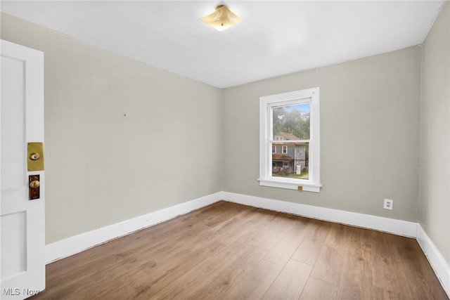 523 Gage St, Akron, OH 44311 - spare room with wood finished floors and baseboards