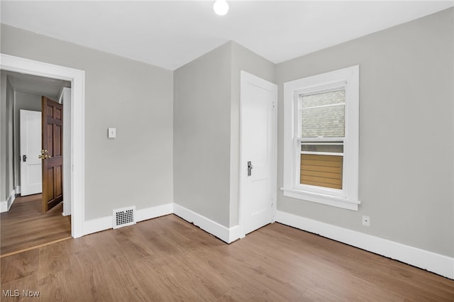523 Gage St, Akron, OH 44311 - spare room with wood finished floors and baseboards