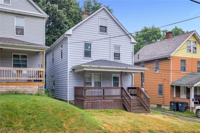 523 Gage St, Akron, OH 44311 - traditional style home featuring covered porch, a front lawn, and a chimney