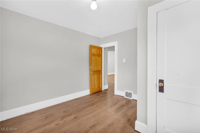 523 Gage St, Akron, OH 44311 - unfurnished bedroom with wood finished floors and baseboards