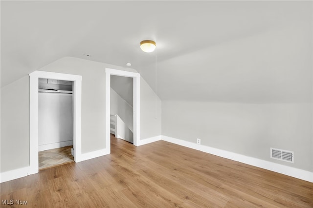 523 Gage St, Akron, OH 44311 - additional living space with vaulted ceiling and light wood-style floors