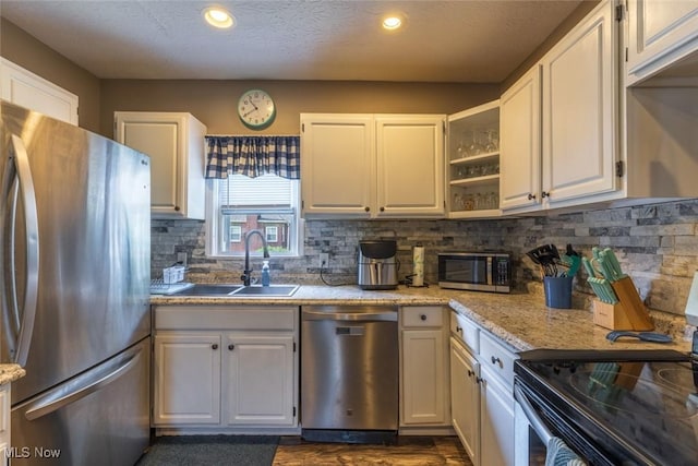 135 S 31st St, Newark, OH 43055 - kitchen featuring stainless steel appliances, backsplash, white cabinetry, recessed lighting, and open shelves