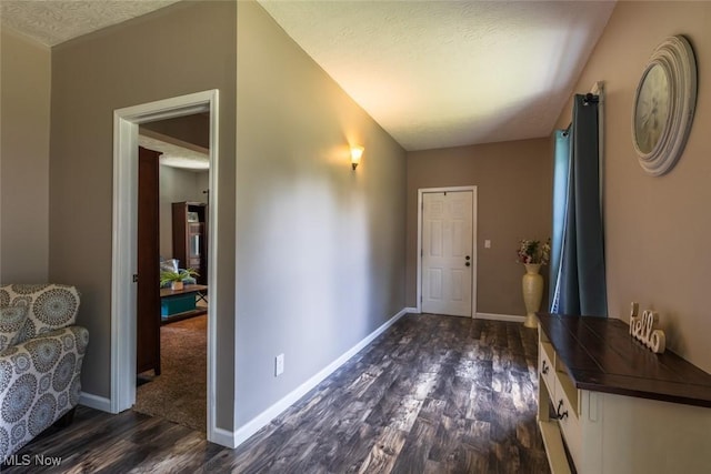 135 S 31st St, Newark, OH 43055 - foyer entrance with dark wood-style flooring and a textured ceiling