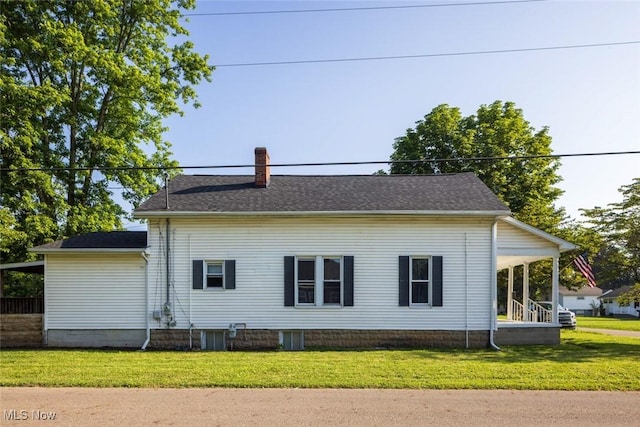 135 S 31st St, Newark, OH 43055 - back of property with a chimney, a lawn, and roof with shingles