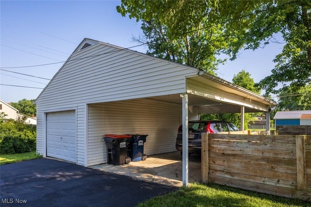 135 S 31st St, Newark, OH 43055 - view of vehicle parking with a garage and asphalt driveway
