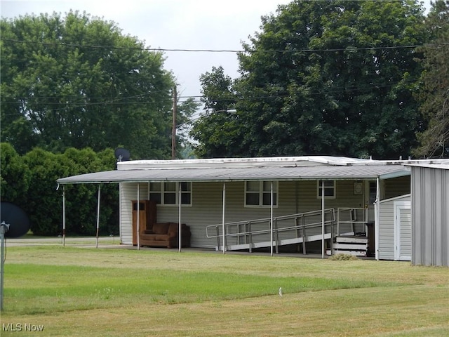 400 N George St, West Lafayette, OH 43845 - rear view of property with a metal roof and a lawn