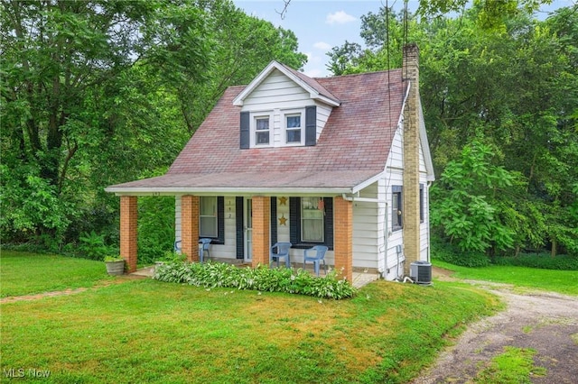 192 Swartz Rd, Akron, OH 44319 - view of front of house featuring a porch, a front lawn, a chimney, and roof with shingles