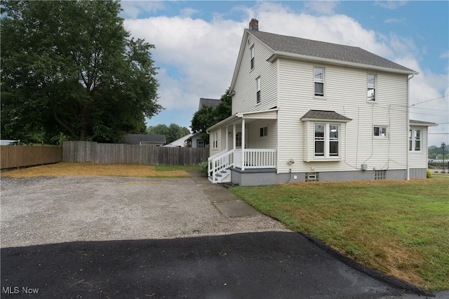 41 New St, Barberton, OH 44203 - view of side of home featuring a chimney, a porch, and a shingled roof