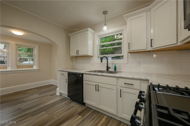 41 New St, Barberton, OH 44203 - kitchen featuring black appliances, tasteful backsplash, dark wood-style floors, ornamental molding, and arched walkways