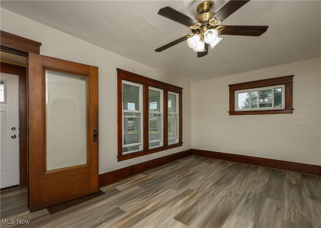 41 New St, Barberton, OH 44203 - empty room with wood finished floors and ceiling fan