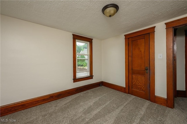 41 New St, Barberton, OH 44203 - unfurnished bedroom with carpet flooring and a textured ceiling