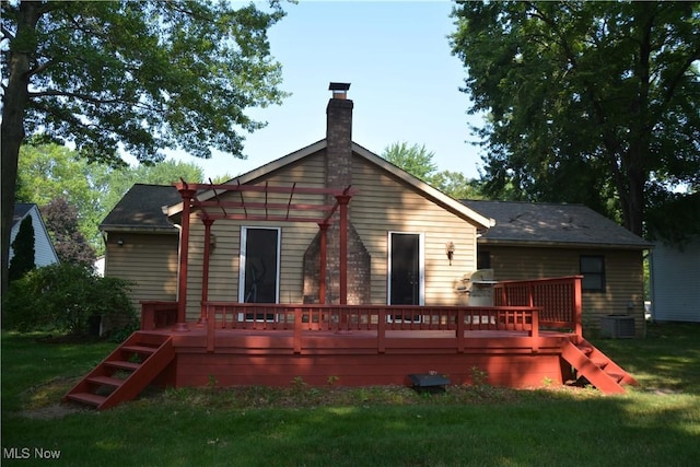 8303 Bradfords Gate Rd, Olmsted Falls, OH 44138 - rear view of property featuring a deck, a chimney, and a lawn