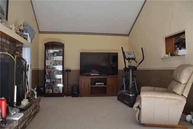 8303 Bradfords Gate Rd, Olmsted Falls, OH 44138 - carpeted living room with a brick fireplace, a wainscoted wall, and vaulted ceiling
