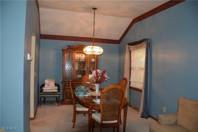8303 Bradfords Gate Rd, Olmsted Falls, OH 44138 - dining area featuring light colored carpet, a chandelier, vaulted ceiling, and crown molding