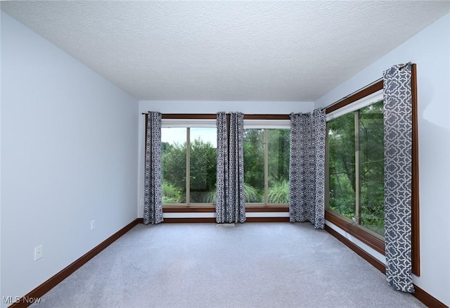 1137 Saint Abigail St SW, Hartville, OH 44632 - spare room featuring a textured ceiling and carpet