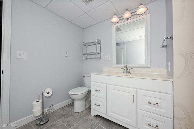 1137 Saint Abigail St SW, Hartville, OH 44632 - bathroom featuring a drop ceiling, vanity, and tile patterned floors