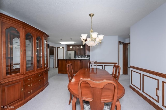 1137 Saint Abigail St SW, Hartville, OH 44632 - dining space with a chandelier and light colored carpet