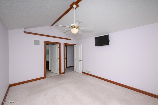 1137 Saint Abigail St SW, Hartville, OH 44632 - unfurnished bedroom with a textured ceiling, light carpet, and a ceiling fan