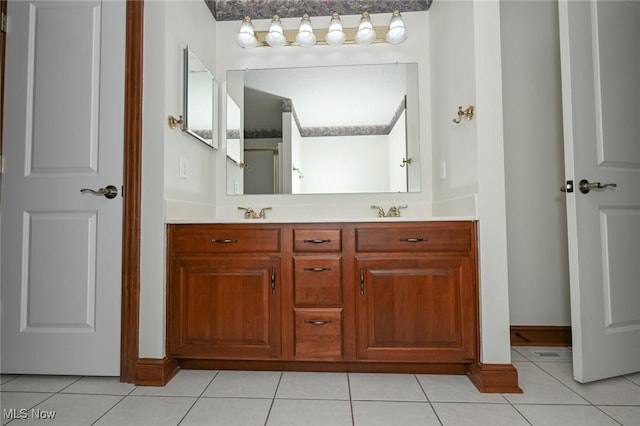 1137 Saint Abigail St SW, Hartville, OH 44632 - bathroom with double vanity and tile patterned flooring