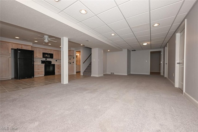 1137 Saint Abigail St SW, Hartville, OH 44632 - unfurnished living room featuring light colored carpet, recessed lighting, stairway, and a ceiling fan