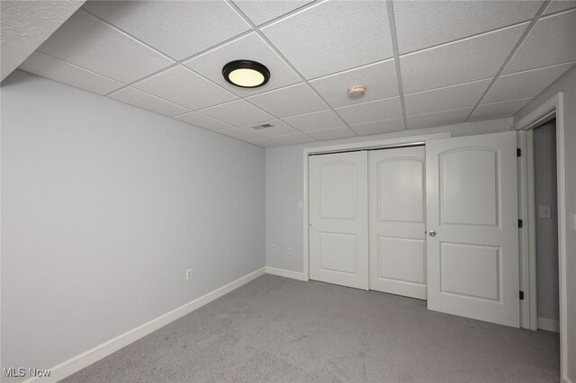1137 Saint Abigail St SW, Hartville, OH 44632 - unfurnished bedroom featuring a paneled ceiling, carpet floors, and a closet