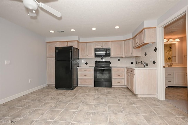 1137 Saint Abigail St SW, Hartville, OH 44632 - kitchen with black appliances, light brown cabinets, light countertops, light tile patterned flooring, and a ceiling fan