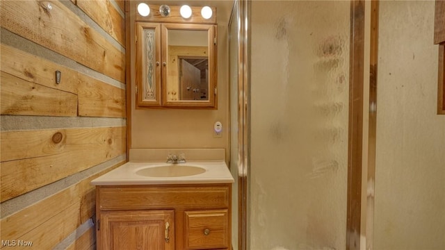 48820 Hillcrest Dr, Caldwell, OH 43724 - full bathroom featuring vanity, a shower stall, and wood walls