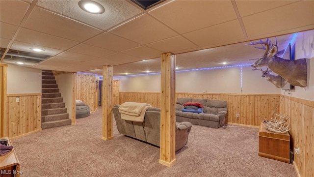 48820 Hillcrest Dr, Caldwell, OH 43724 - finished basement with wooden walls, wainscoting, carpet flooring, a drop ceiling, and stairway