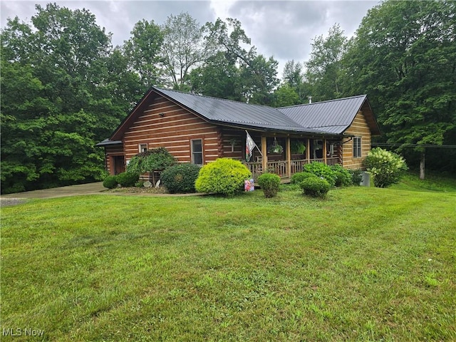 48820 Hillcrest Dr, Caldwell, OH 43724 - cabin featuring a porch, a front lawn, and a metal roof