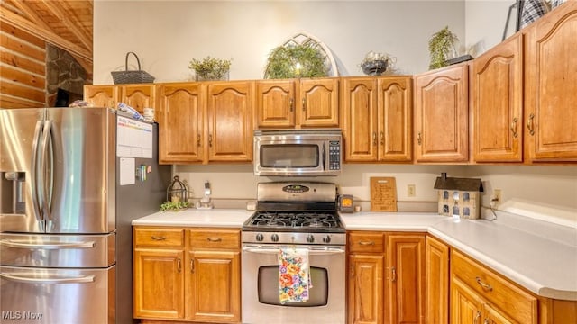 48820 Hillcrest Dr, Caldwell, OH 43724 - kitchen featuring appliances with stainless steel finishes, light countertops, wood ceiling, and brown cabinets