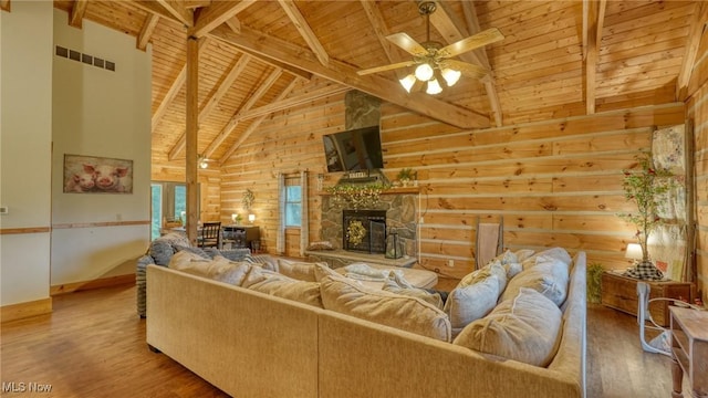 48820 Hillcrest Dr, Caldwell, OH 43724 - living room with a wood ceiling with exposed beams, a ceiling fan, high vaulted ceiling, wood finished floors, and a fireplace