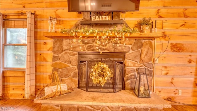 48820 Hillcrest Dr, Caldwell, OH 43724 - detailed view of wooden walls, wood finished floors, and a stone fireplace