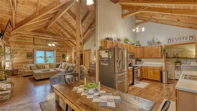 48820 Hillcrest Dr, Caldwell, OH 43724 - kitchen with washing machine and clothes dryer, a wooden ceiling with exposed beams, appliances with stainless steel finishes, high vaulted ceiling, and light wood-type flooring