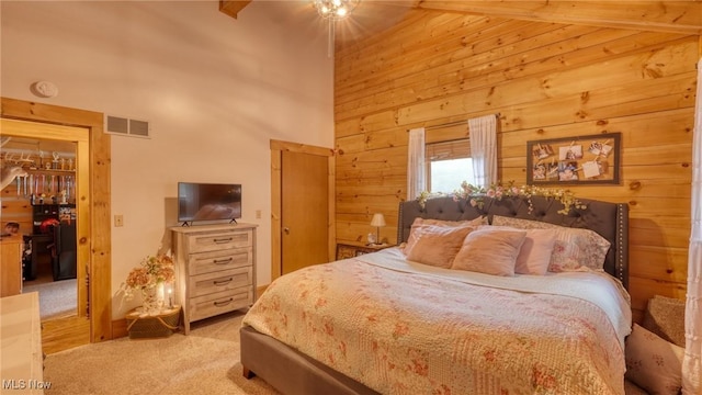 48820 Hillcrest Dr, Caldwell, OH 43724 - bedroom featuring carpet flooring, wooden walls, a towering ceiling, and a ceiling fan