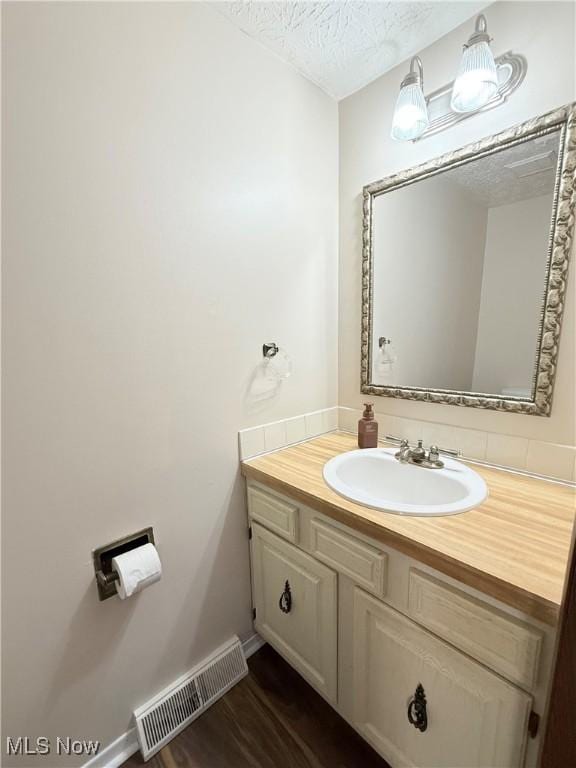 1489 Munroe Falls Ave, Cuyahoga Falls, OH 44221 - bathroom with vanity and a textured ceiling