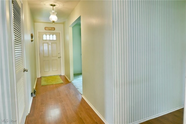2741 Citadel Dr NE, Warren, OH 44483 - doorway to outside featuring wood finished floors