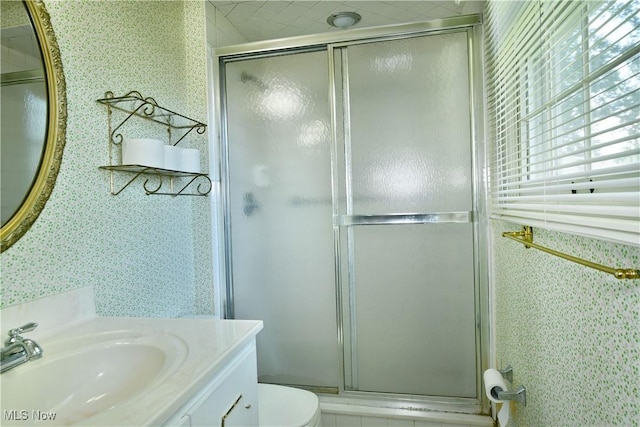 2741 Citadel Dr NE, Warren, OH 44483 - bathroom featuring wallpapered walls, vanity, and a shower stall