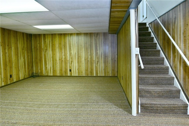 2741 Citadel Dr NE, Warren, OH 44483 - stairway with carpet floors, wood walls, and a drop ceiling