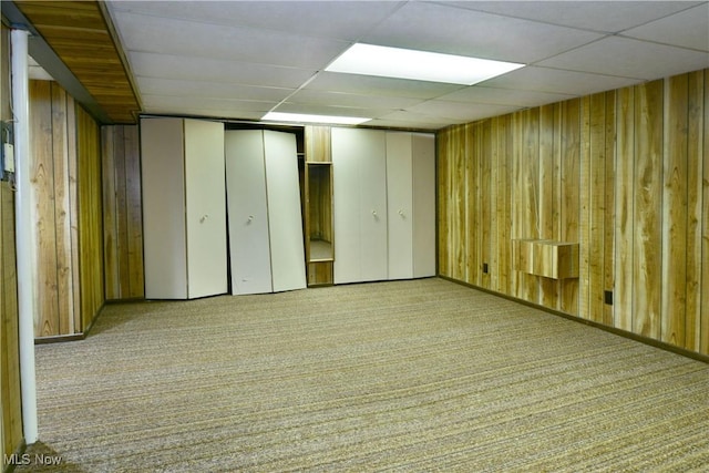 2741 Citadel Dr NE, Warren, OH 44483 - finished basement with wooden walls, carpet floors, and a paneled ceiling
