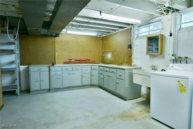 2741 Citadel Dr NE, Warren, OH 44483 - basement featuring washer / clothes dryer and a sink