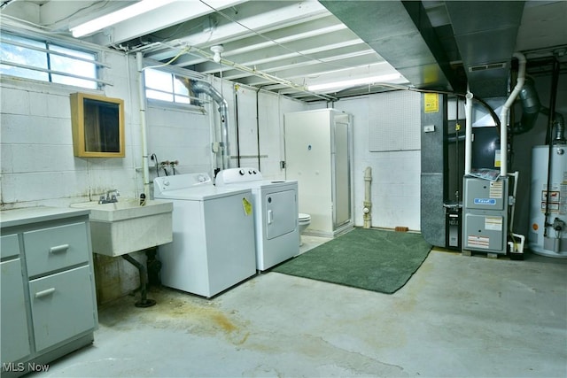 2741 Citadel Dr NE, Warren, OH 44483 - below grade area with washer and dryer, water heater, heating unit, and concrete block wall