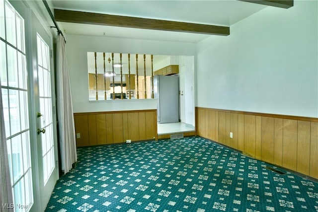 2741 Citadel Dr NE, Warren, OH 44483 - unfurnished room featuring beam ceiling, wainscoting, carpet flooring, and wooden walls