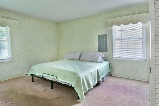 2741 Citadel Dr NE, Warren, OH 44483 - bedroom featuring multiple windows, carpet floors, electric panel, and wallpapered walls
