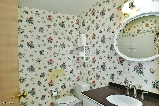 2741 Citadel Dr NE, Warren, OH 44483 - half bathroom featuring vanity and wallpapered walls