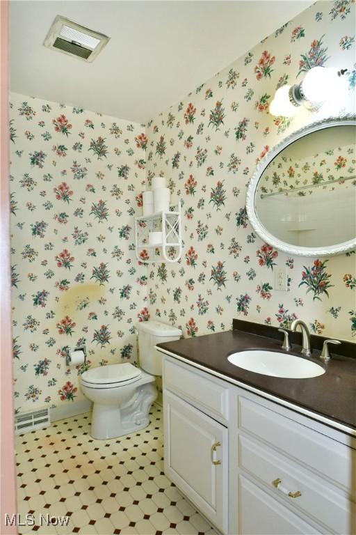 2741 Citadel Dr NE, Warren, OH 44483 - half bath with wallpapered walls and vanity